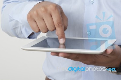 Touching A Digital Tablet Stock Photo