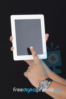 Touching The Digital Tablet With Index Finger Stock Photo