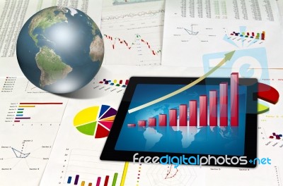 Touchpad On Financial Graphs Stock Image