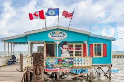 Tour Center At Wooden Pier Dock In Caye Caulker Belize Stock Photo