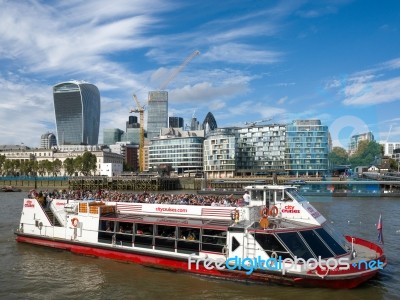 Tourist Boat Cruising Along The River Thames Stock Photo