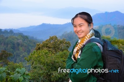 Tourist Girl On The Mountain Stock Photo