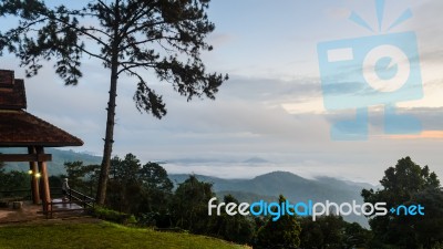 Tourists Are Standing Views Of High Mountains And Haze Stock Photo