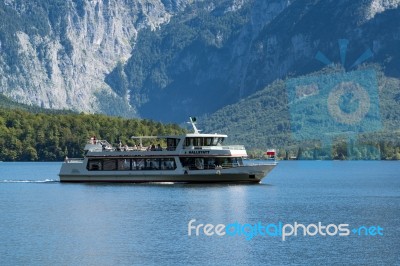 Tourists Enjoying An Excursion On Lake Hallstatt Stock Photo