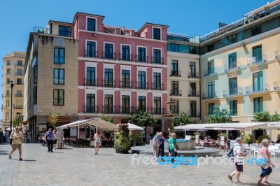 Tourists Walking Across The Plaza De Obispo In Malaga Stock Photo