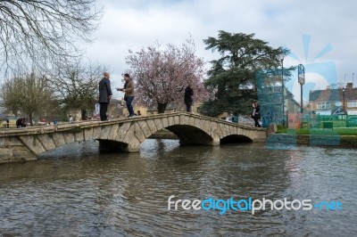 Tourists Wandering Around Bourton-on-the-water Stock Photo