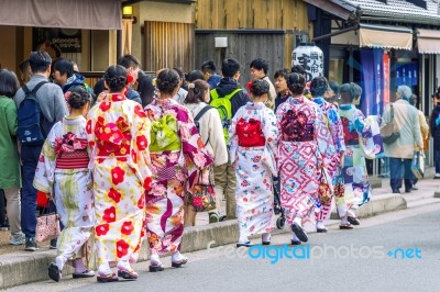 Tourists Wearing Japanese Traditional Kimono Walking In Arashiyama,kyoto In Japan Stock Photo