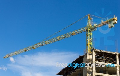 Tower Crane And Skyscraper On Blue Sky Background Stock Photo