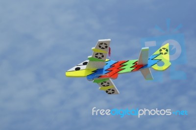 Toy Plane Against Blue Sky Stock Photo