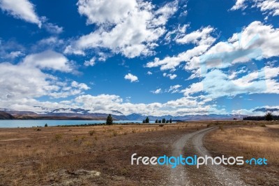 Track Running Alongside Lake Tekapo Stock Photo