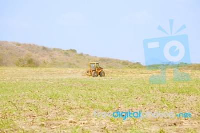 Tractor Plowing Field Stock Photo