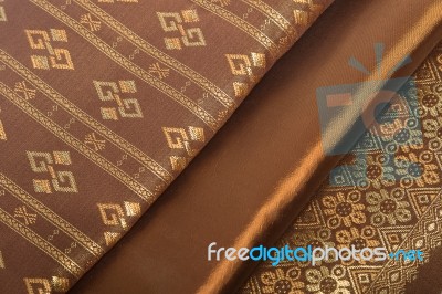 Traditional Brown Thai Fabric Pattern Stock Photo