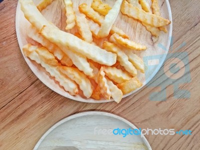 Traditional French Fries On Wood Background Stock Photo