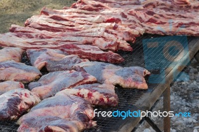 Traditional Meat Grilled On The Grill In The Argentine Countryside Stock Photo