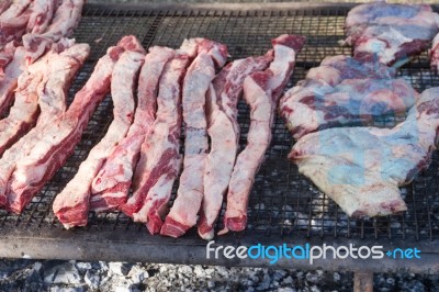 Traditional Meat Grilled On The Grill In The Argentine Countryside Stock Photo