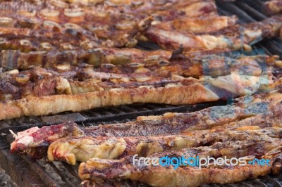 Traditional Meat Grilled On The Grill In The Argentine Countryside Stock Photo