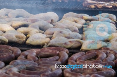 Traditional Meat Grilled On The Grill In The Argentine Countryside Stock Photo