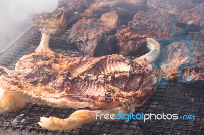 Traditional Meat Grilled On The Grill In The Argentine Countryside Stock Photo