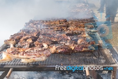 Traditional Meat Grilled On The Grill In The Argentine Countryside Stock Photo