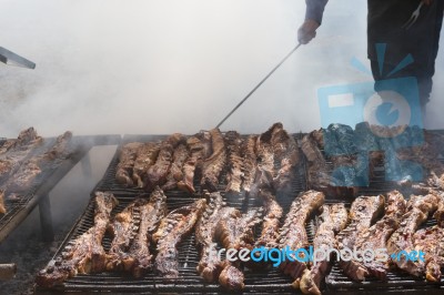 Traditional Meat Grilled On The Grill In The Argentine Countryside Stock Photo