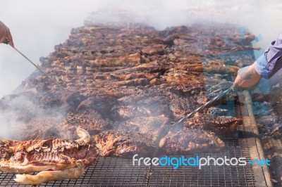 Traditional Meat Grilled On The Grill In The Argentine Countryside Stock Photo