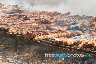 Traditional Meat Grilled On The Grill In The Argentine Countryside Stock Photo