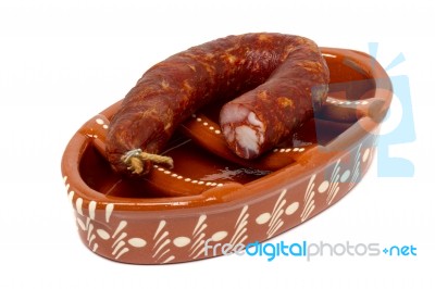 Traditional Portuguese Pottery For Grilling Chorizos Stock Photo