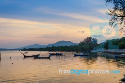 Traditional Thai Long Tail Boats At Sunset In Phuket Stock Photo