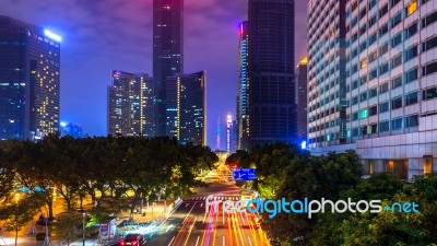 Traffic And Cityscape At Night In Guangzhou, China Stock Photo