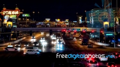 Traffic On The Strip Illuminated At Night In Las Vegas Stock Photo