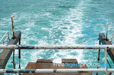 Trail On Water Surface Behind Of Fast Moving Motor Boat Stock Photo