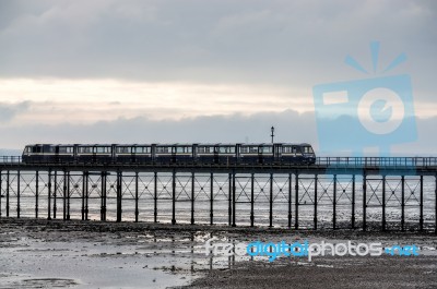 Train Running Along Southend Pier In Essex Stock Photo