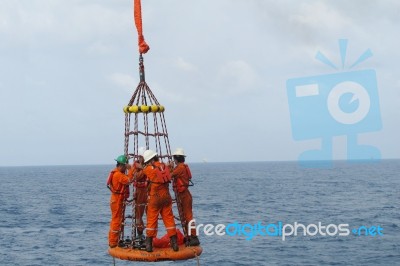 Transfer Crews By Personal Basket From The Platform To Crews Boat Stock Photo