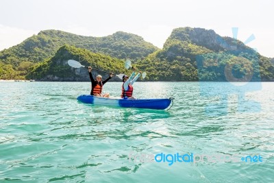 Travel By Boat With A Kayak Stock Photo