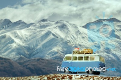 Traveling Car Parking On Road Side Against Beautiful Snow Mountain Background Stock Photo