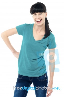 Trendy Lady Posing In Style And Flashing A Smile Stock Photo