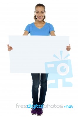 Trendy Woman Displaying Blank Billboard Stock Photo