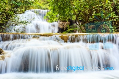 Tropical Waterfall In Kanchanaburi, Thailand Stock Photo