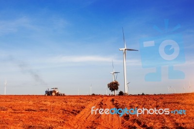 Truck Tractors Are Plowing Tillage With The Blue Sky Stock Photo