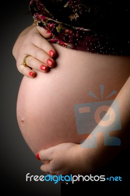 Tummy Of Pregnant Woman Stock Photo