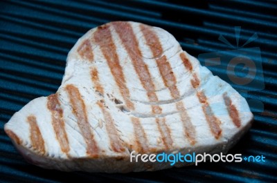 Tuna Steak Cooking On A Grill Stock Photo