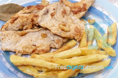 Turkey Steak With French Fries Stock Photo