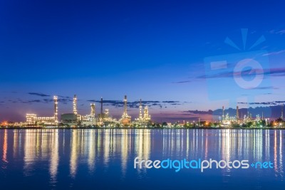 Twilight At Petroleum Refinery Along The River Stock Photo