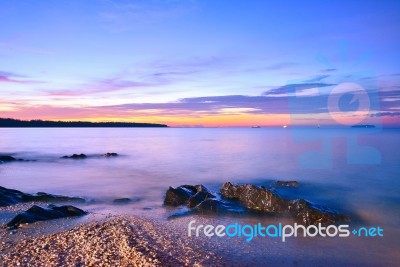 Twilight Mist Sea With Rocks In Samila Beach, Songkhla Stock Photo