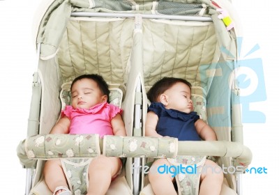 Twins Sleeping In Stroller Stock Photo