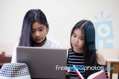 Two Asia Thai High School Student Uniform Best Friends Beautiful Girl Using Her Laptop Stock Photo