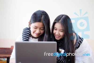 Two Asia Thai High School Student Uniform Best Friends Beautiful Girl Using Her Laptop Stock Photo