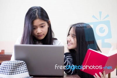 Two Asia Thai High School Student Uniform Best Friends Beautiful Girl Using Her Laptop Stock Photo