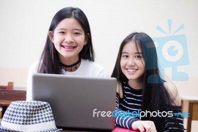 Two Asia Thai High School Student Uniform Best Friends Beautiful Girl Using Her Laptop Stock Photo