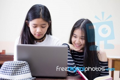 Two Asia Thai High School Student Uniform Best Friends Beautiful Girl Using Her Laptop Stock Photo